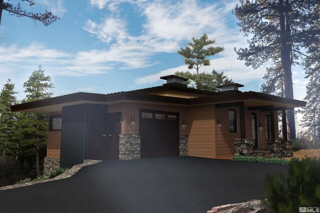 200 Overlook Dr Unit 29, Carson City, NV 89705 - view of front of house with stone siding, asphalt driveway, and an attached garage