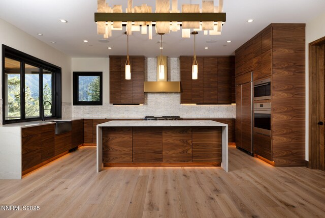 200 Overlook Dr Unit 29, Carson City, NV 89705 - kitchen featuring modern cabinets, wall chimney range hood, light countertops, light wood finished floors, and recessed lighting