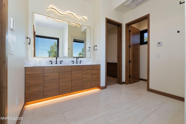200 Overlook Dr Unit 29, Carson City, NV 89705 - bathroom with double vanity and baseboards