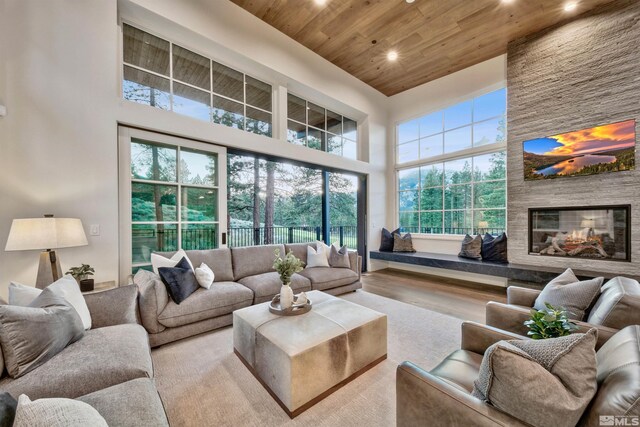 265 Mill Race Loop, Carson City, NV 89705 - living area with wooden ceiling, a towering ceiling, a fireplace, recessed lighting, and wood finished floors