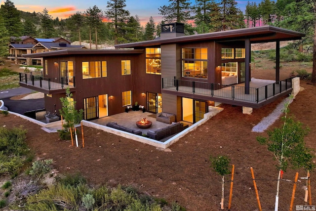 265 Mill Race Loop, Carson City, NV 89705 - back of house with an outdoor fire pit, a patio area, and a deck