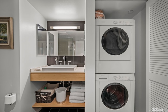 255 N Sierra St Unit 2013, Reno, NV 89501 - laundry room featuring estacked washer and dryer and tile patterned floors