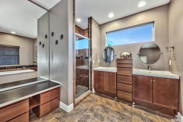 1008 Keystone Ct, Gardnerville, NV 89460 - bathroom with a stall shower, two vanities, a garden tub, and recessed lighting