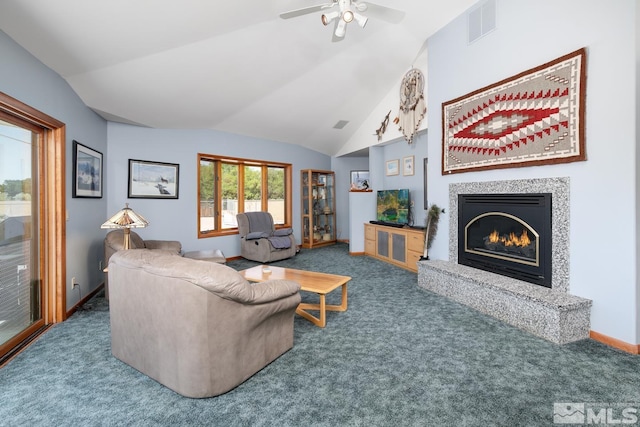 4223 Rancheria Rd, Fallon, NV 89406 - living area featuring carpet, vaulted ceiling, a glass covered fireplace, ceiling fan, and baseboards