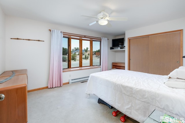 4223 Rancheria Rd, Fallon, NV 89406 - carpeted bedroom with a baseboard radiator, a closet, baseboards, and ceiling fan