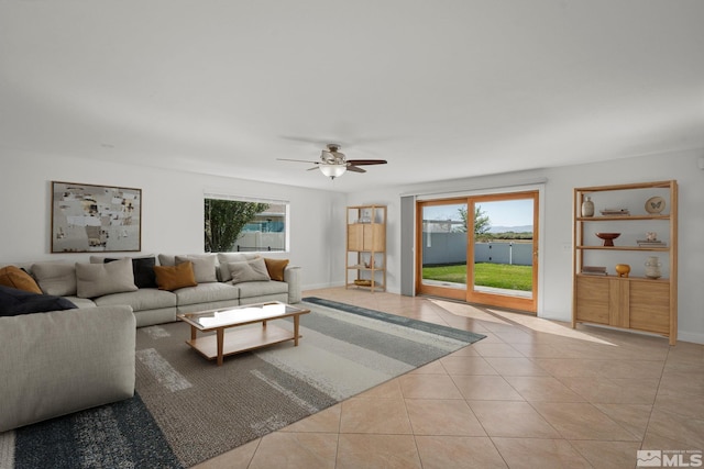 1663 Mackland Dr, Minden, NV 89423 - living area featuring a ceiling fan, healthy amount of natural light, tile patterned floors, and baseboards