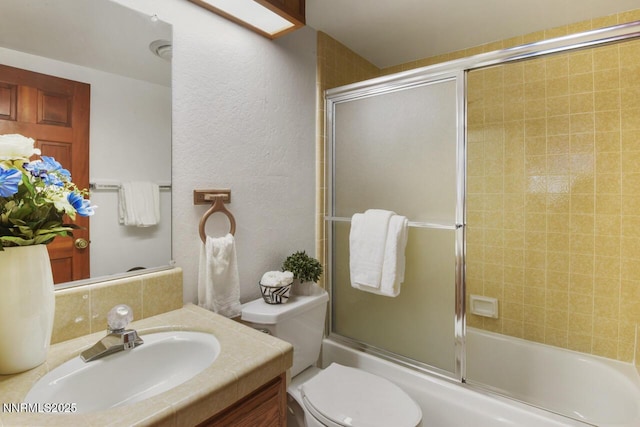 696 Village Blvd Unit 12, Incline Village, NV 89451 - bathroom featuring vanity, combined bath / shower with glass door, and a textured wall
