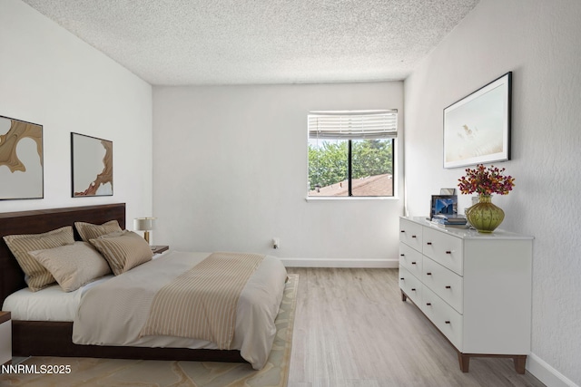 1000 Beck St Unit 276, Reno, NV 89509 - bedroom with light wood-type flooring and a textured ceiling