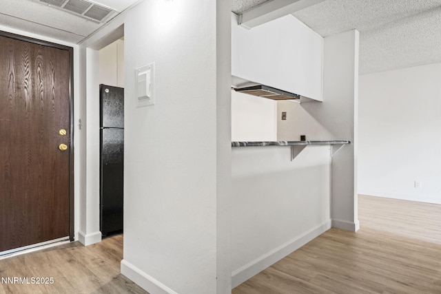 1000 Beck St Unit 276, Reno, NV 89509 - hallway featuring light wood-style flooring and a textured ceiling