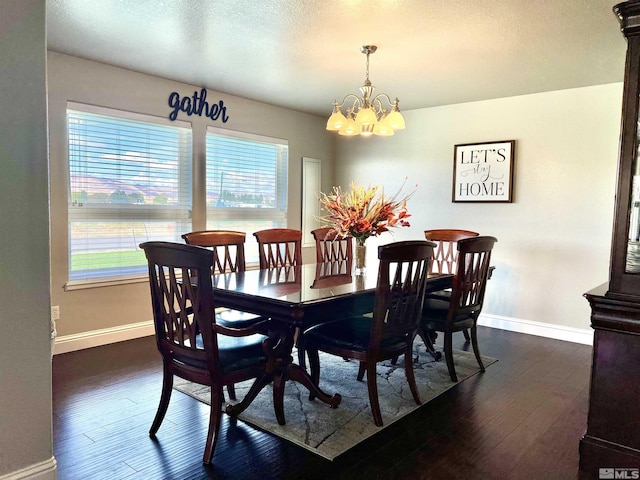 310 N Mountain View St, Yerington, NV 89447 - dining space with a chandelier, baseboards, and dark wood finished floors