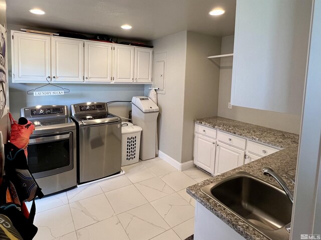 310 N Mountain View St, Yerington, NV 89447 - laundry area featuring independent washer and dryer, cabinet space, light marble finish flooring, recessed lighting, and baseboards