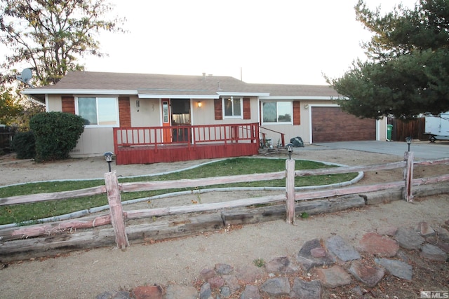 27 Amanda Cir, Sparks, NV 89436 - ranch-style home with a fenced front yard, covered porch, concrete driveway, a garage, and roof with shingles