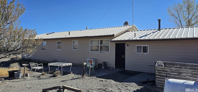 316 Toiyabe Rd, Kingston, NV 89310 - rear view of house featuring a patio and metal roof