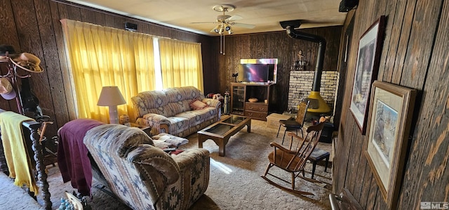 316 Toiyabe Rd, Kingston, NV 89310 - carpeted living room with ceiling fan, wooden walls, and a wood stove