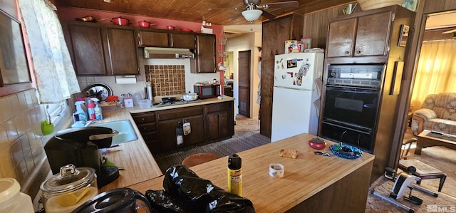 316 Toiyabe Rd, Kingston, NV 89310 - kitchen with freestanding refrigerator, oven, light countertops, a sink, and wood ceiling