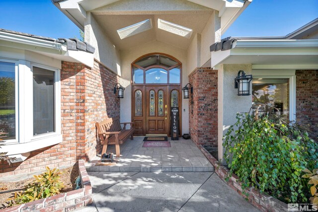1865 Olive Ln, Reno, NV 89511 - entrance to property featuring stucco siding and brick siding