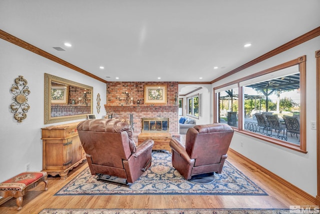 1865 Olive Ln, Reno, NV 89511 - living room featuring light wood finished floors, crown molding, a fireplace, recessed lighting, and baseboards