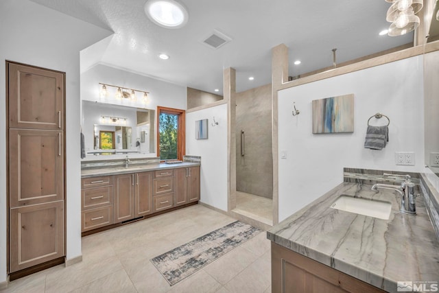 1865 Olive Ln, Reno, NV 89511 - full bathroom featuring walk in shower, two vanities, and tile patterned floors