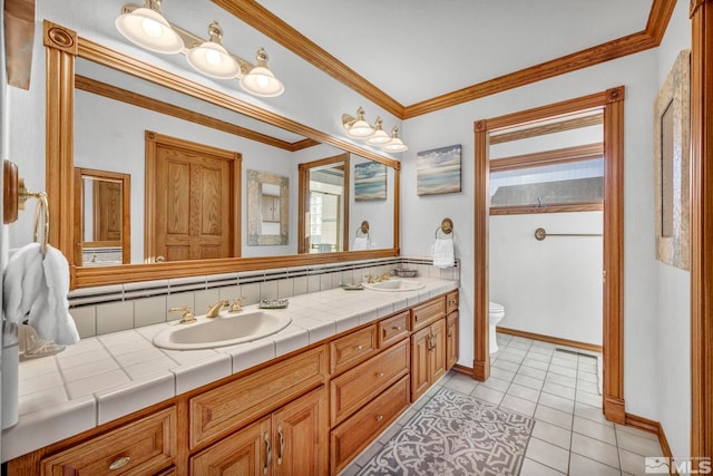 1865 Olive Ln, Reno, NV 89511 - full bathroom featuring toilet, tile patterned floors, double vanity, ornamental molding, and baseboards