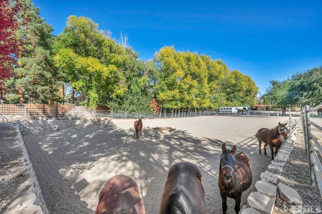 1865 Olive Ln, Reno, NV 89511 - view of home's community featuring an outdoor riding arena, view of scattered trees, and fence