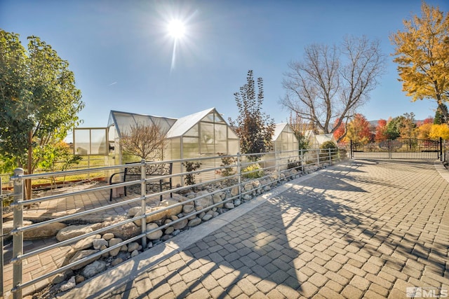1865 Olive Ln, Reno, NV 89511 - view of property's community featuring a greenhouse, an outbuilding, and fence