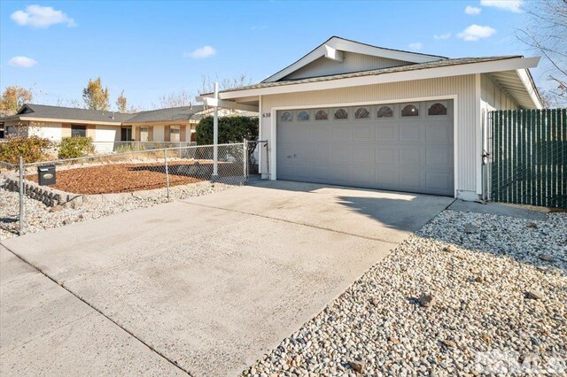 630 Teel St, Sparks, NV 89431 - ranch-style home featuring concrete driveway, fence, a garage, and a gate