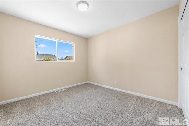 630 Teel St, Sparks, NV 89431 - spare room featuring carpet flooring and baseboards