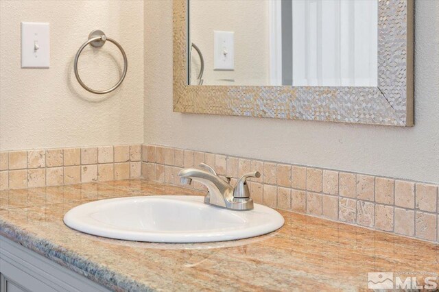 630 Teel St, Sparks, NV 89431 - bathroom featuring backsplash and vanity