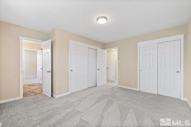 630 Teel St, Sparks, NV 89431 - unfurnished bedroom with multiple closets, carpet flooring, and baseboards