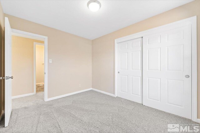 630 Teel St, Sparks, NV 89431 - unfurnished bedroom with carpet flooring, baseboards, and a closet
