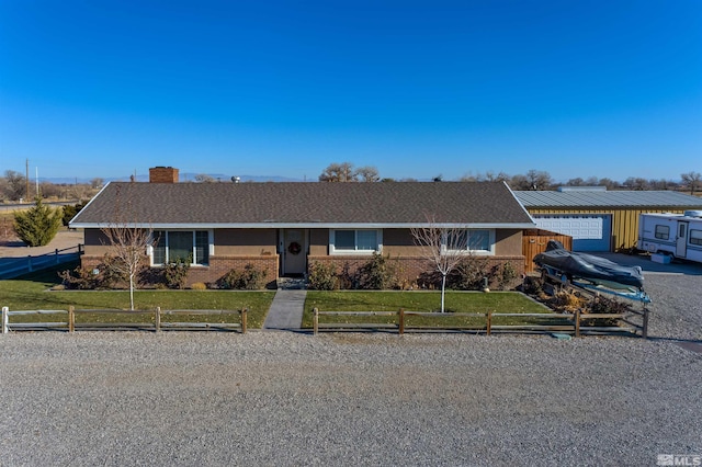 3205 Saint Clair Rd, Fallon, NV 89406 - single story home with a chimney, brick siding, and roof with shingles