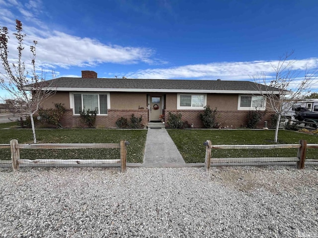 3205 Saint Clair Rd, Fallon, NV 89406 - ranch-style home featuring brick siding and a chimney