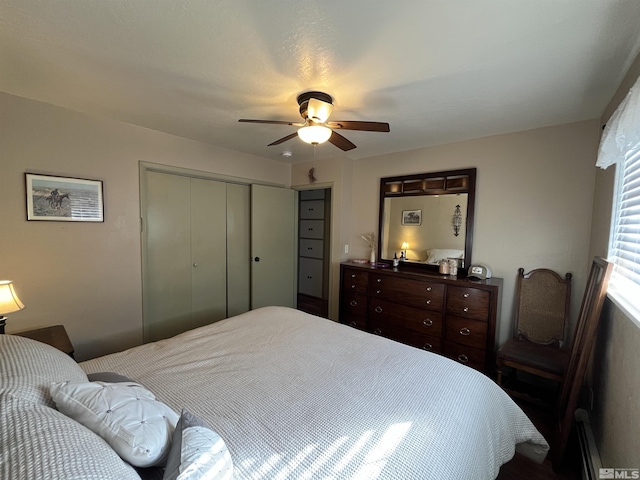 3205 Saint Clair Rd, Fallon, NV 89406 - bedroom featuring a closet, a ceiling fan, and a baseboard heating unit