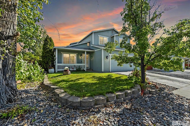 17850 Brushland Dr, Reno, NV 89508 - view of front of property featuring a porch, a yard, driveway, and an attached garage