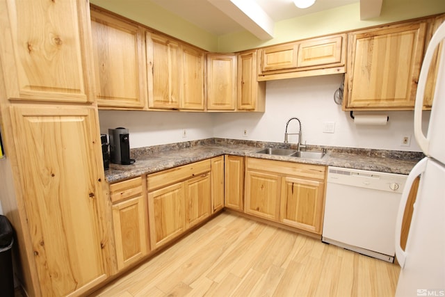 101 Hermansen, Hawthorne, NV 89415 - kitchen featuring white appliances, a sink, light brown cabinetry, light wood-style flooring, and dark countertops