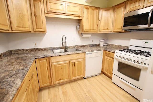 101 Hermansen, Hawthorne, NV 89415 - kitchen with white appliances, a sink, light brown cabinetry, and light wood-type flooring