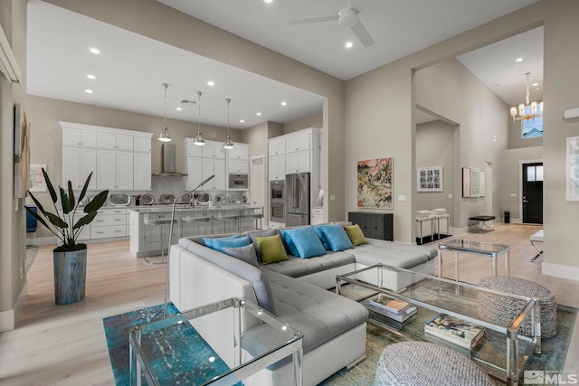718 W Pleasant Oak Trl, Reno, NV 89511 - living area with ceiling fan, recessed lighting, light wood finished floors, a chandelier, and baseboards