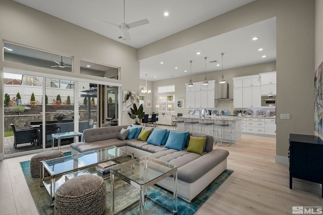 718 W Pleasant Oak Trl, Reno, NV 89511 - living area featuring ceiling fan, recessed lighting, light wood-style flooring, and a chandelier