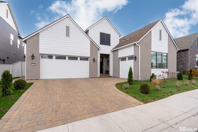718 W Pleasant Oak Trl, Reno, NV 89511 - view of front of house with decorative driveway, stucco siding, and a garage