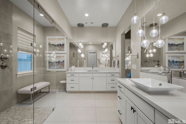 718 W Pleasant Oak Trl, Reno, NV 89511 - bathroom featuring a tile shower, tile patterned floors, and two vanities