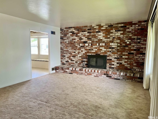 2 N Whitacre St, Yerington, NV 89447 - unfurnished living room with carpet, a brick fireplace, and baseboards