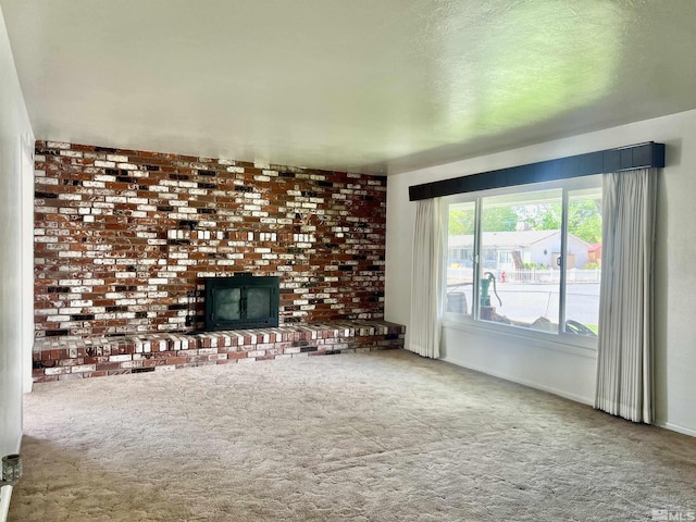 2 N Whitacre St, Yerington, NV 89447 - unfurnished living room featuring carpet, a fireplace, and baseboards