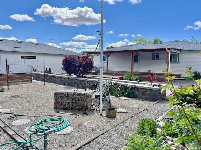 2 N Whitacre St, Yerington, NV 89447 - rear view of property with a patio area, fence, and roof with shingles