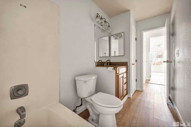 4608 Neil Rd Unit 241, Reno, NV 89502 - full bath featuring wood finished floors, toilet, and baseboards