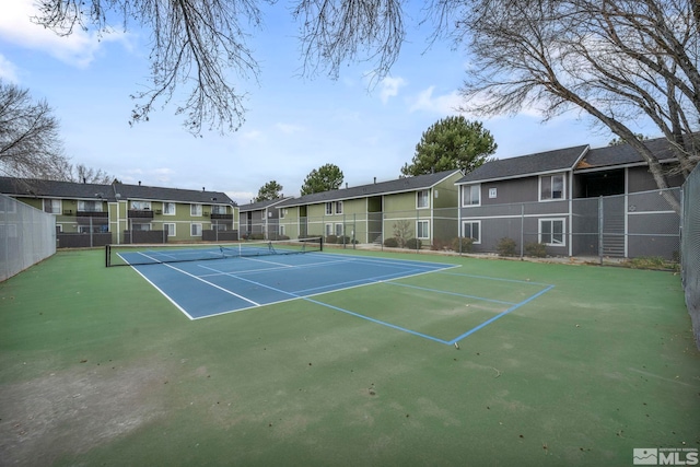 4608 Neil Rd Unit 241, Reno, NV 89502 - view of tennis court with fence and a residential view