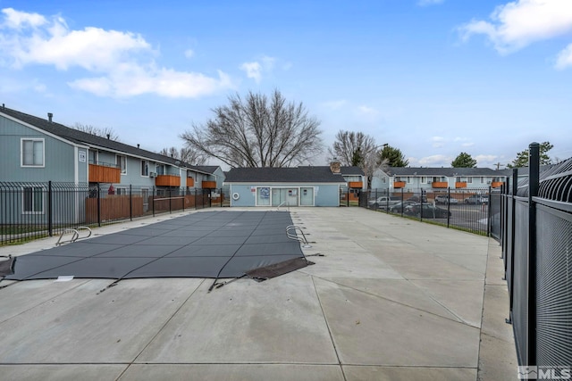 4608 Neil Rd Unit 241, Reno, NV 89502 - community pool featuring a patio area, fence, and a residential view