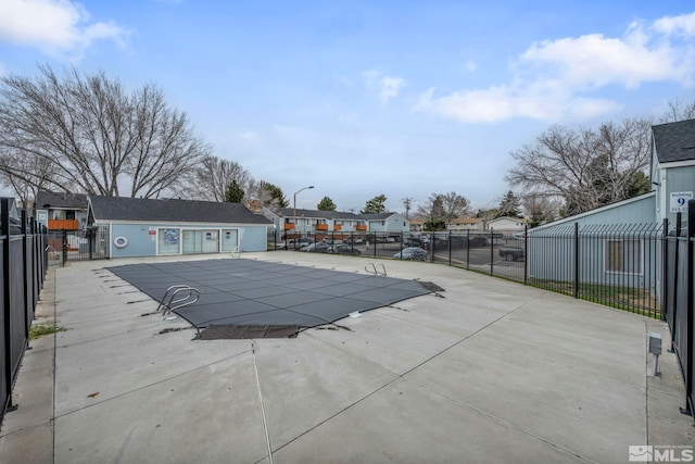4608 Neil Rd Unit 241, Reno, NV 89502 - community pool featuring a patio area, fence, and a residential view