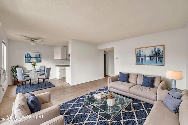 4608 Neil Rd Unit 241, Reno, NV 89502 - living area with light wood-type flooring, ceiling fan, and baseboards