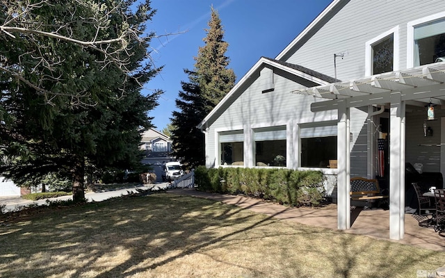 3678 Brighton Way, Reno, NV 89509 - view of side of property featuring a pergola, a patio area, and a yard