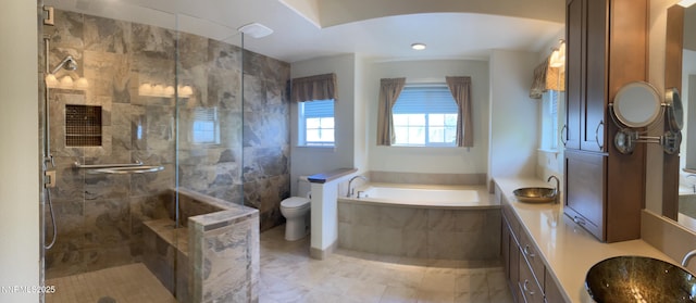 3678 Brighton Way, Reno, NV 89509 - bathroom featuring a garden tub, a shower stall, double vanity, toilet, and marble finish floors